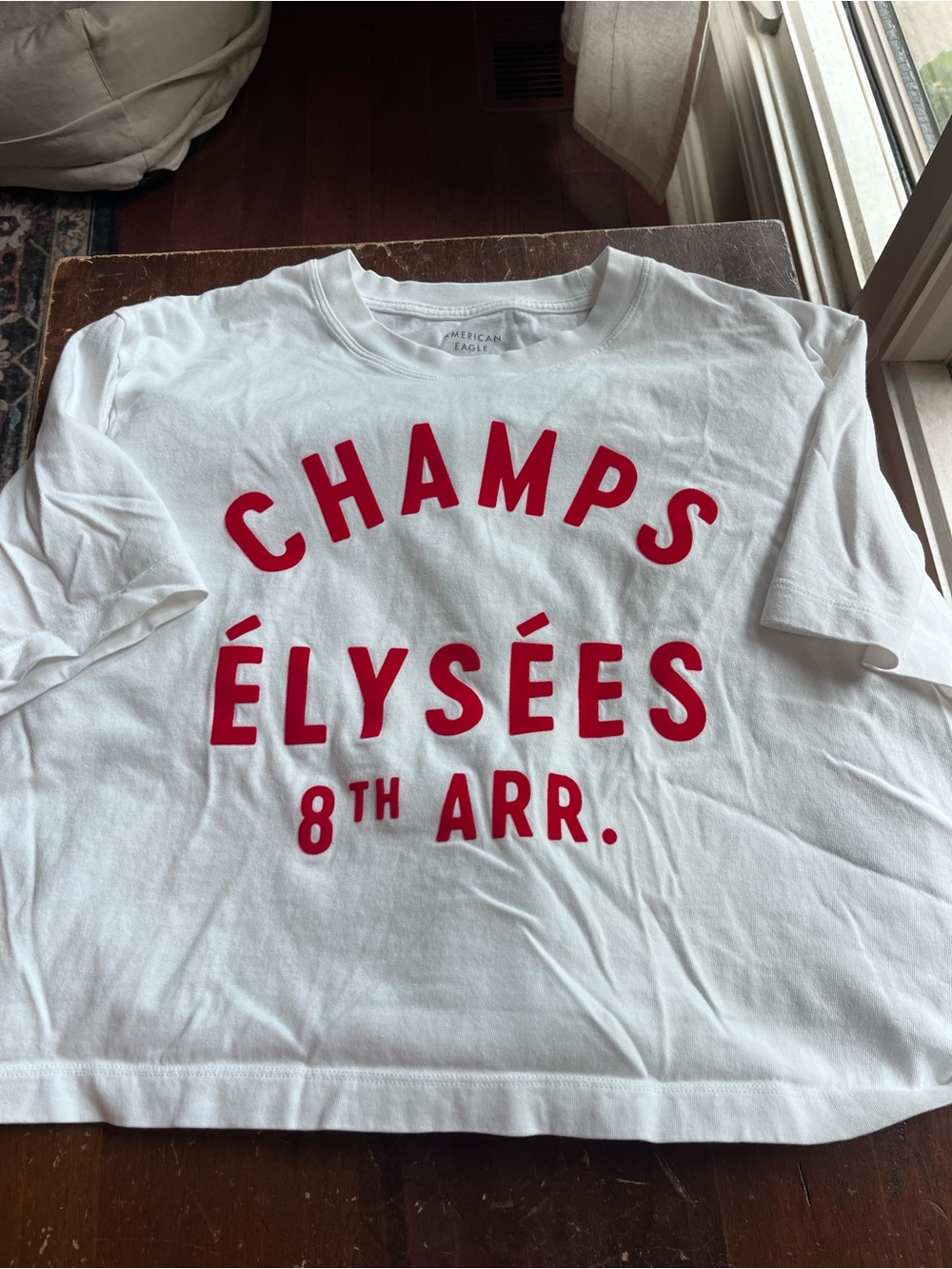American Eagle Crop White 'Champs Élysées' Graphic Tee with Red Lettering